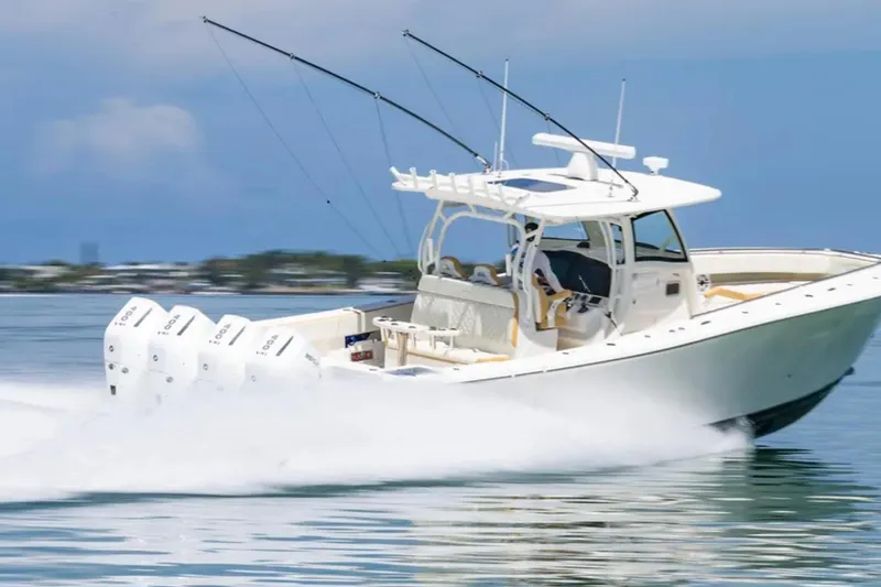 Slide: The Image of 2024 Blackwater 43 Sportfish boat speeding on water with multiple outboard engines. - 73