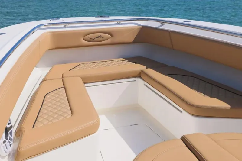 Slide: The Image of 2026 Blackwater 41 Performance Fish boat interior with logo on tan upholstery. - 11