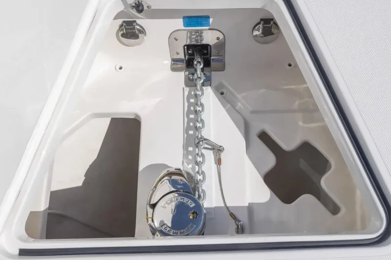 Slide: The Image of 2025 Blackwater 41 Performance Fish boat interior with tan quilted seating and storage compartment. - 16