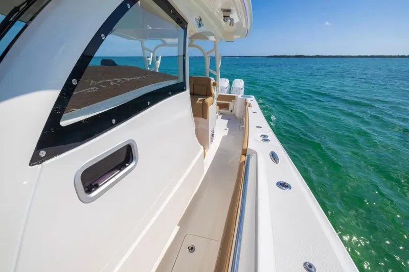 Slide: The Image of 2026 Blackwater 41 Performance Fish boat with Garmin radar on calm water. - 18