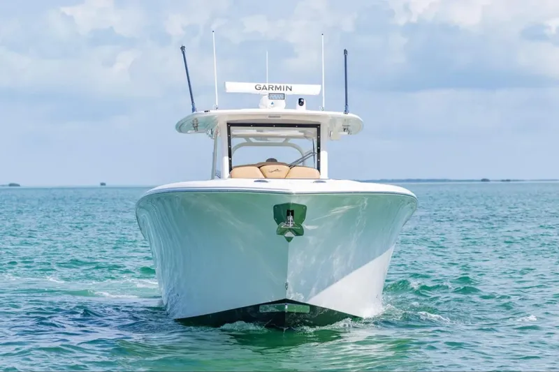 Slide: The Image of Aerial view of 2026 Blackwater 41 Performance Fish boat on green water. - 2