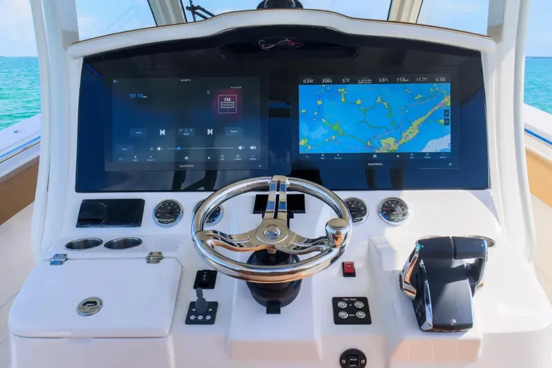 Slide: The Image of 2025 Blackwater 41 Performance Fish boat on clear blue water, side view. - 20