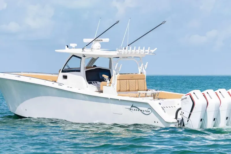 Slide: The Image of 2025 Blackwater 41 Performance Fish boat cruising on clear blue water. - 3