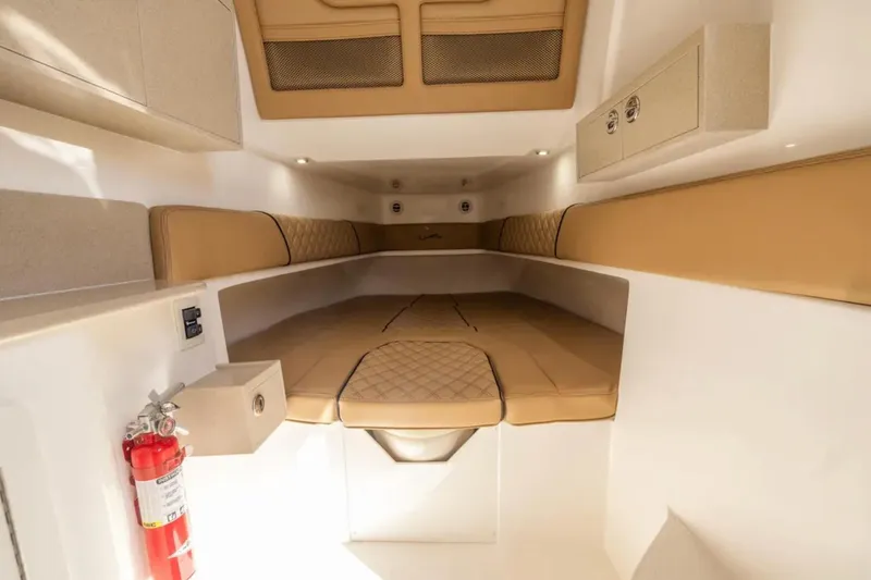 Slide: The Image of 2026 Blackwater 41 Performance Fish boat interior with tan seating and ocean view. - 32
