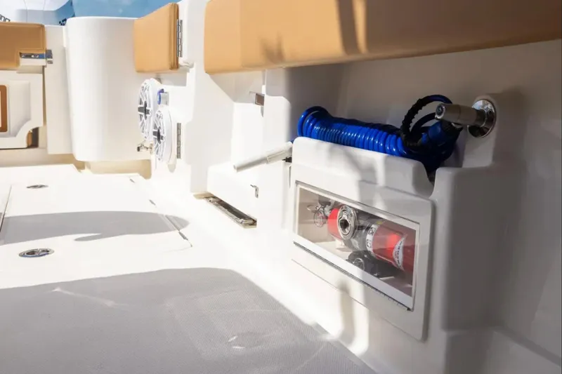 Slide: The Image of 2026 Blackwater 41 Performance Fish boat interior with seating and ocean view. - 35