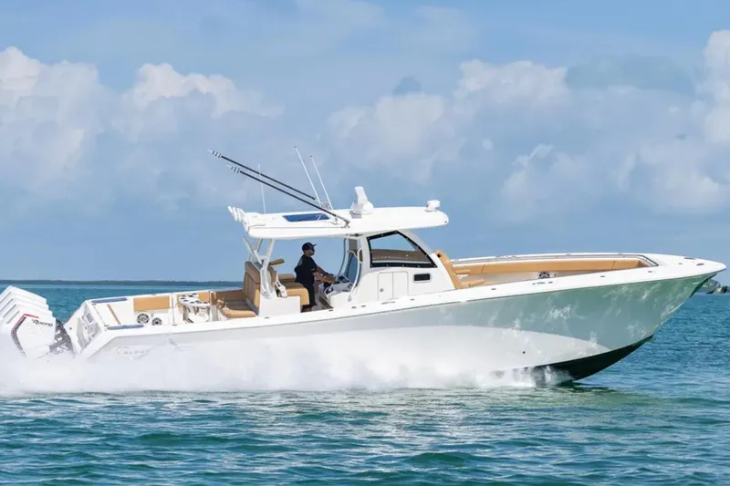 Slide: The Image of Storage compartment on 2026 Blackwater 41 Performance Fish boat with coiled hose and fire extinguisher. - 45