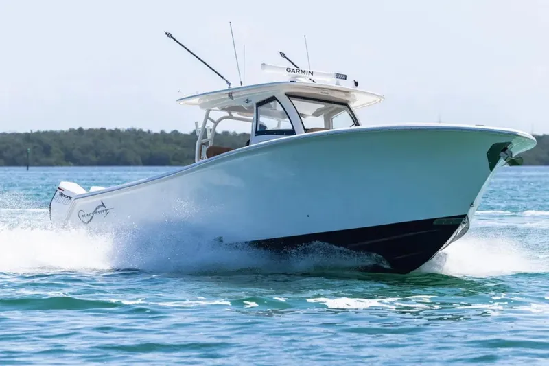 Slide: The Image of Luxurious cabin interior of 2026 Blackwater 41 Performance Fish boat with tan upholstery. - 50