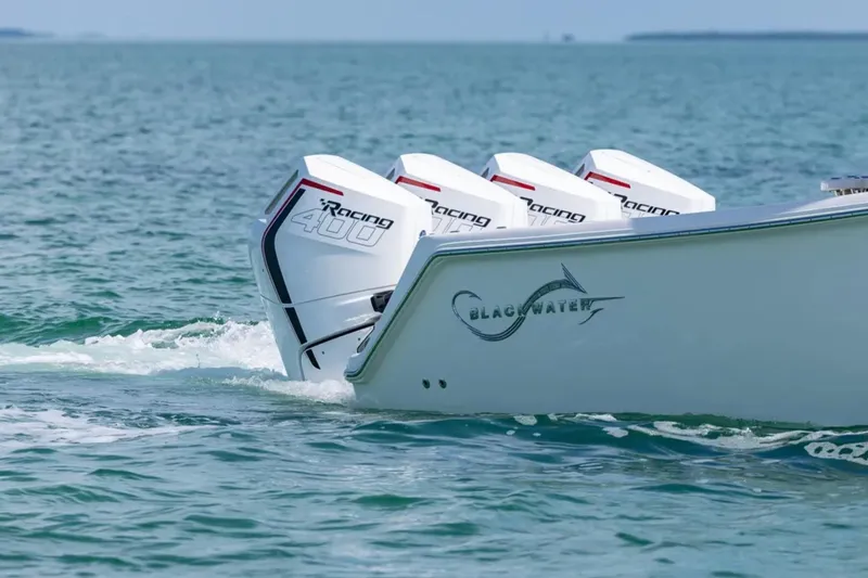 Slide: The Image of 2026 Blackwater 41 Performance Fish boat on water, clear sky, city skyline in background. - 6