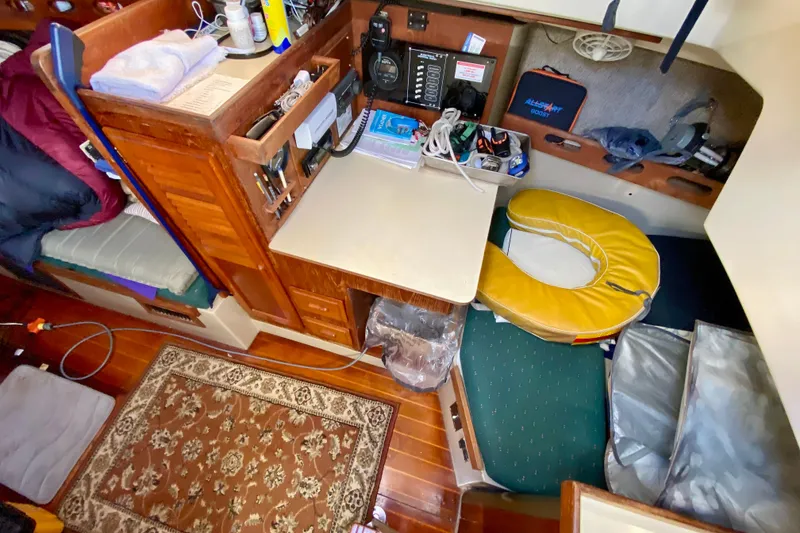 Slide: The Image of Interior of a 1987 O'Day 34 sailboat with navigation station and equipment. - 15