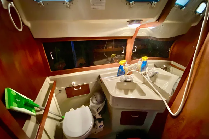 Slide: The Image of Bathroom interior of a 1987 O'Day 34 sailboat with sink and toilet. - 21