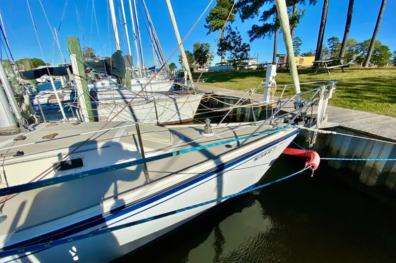 Slide: The Image of 1987 O'Day 34 sailboat docked at marina with clear blue sky. - 3