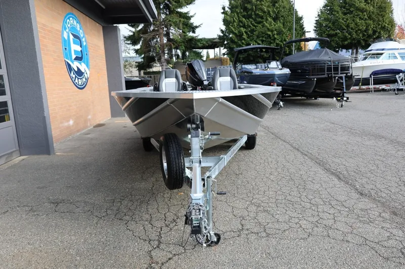 Slide: The Image of 2026 Thunder Jet 229 Rush OT boat on trailer at dealership lot. - 11