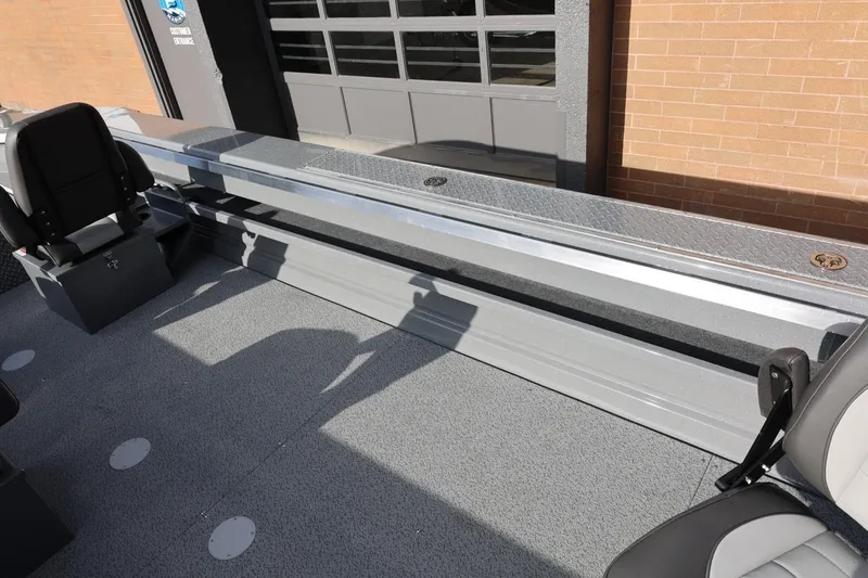 Slide: The Image of 2026 Thunder Jet 229 Rush OT boat interior with seating and storage compartments. - 17