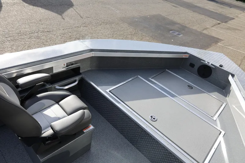 Slide: The Image of 2026 Thunder Jet 229 Rush OT boat interior with seating and storage compartments. - 19