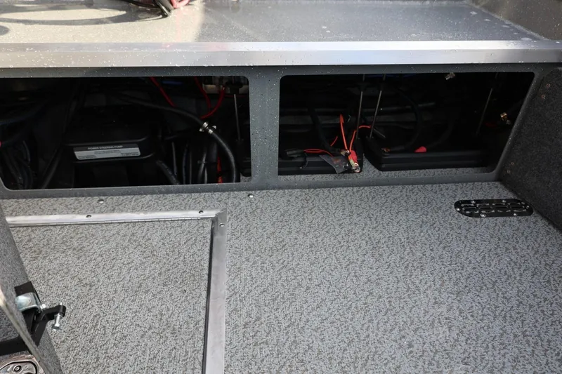 Slide: The Image of Interior view of 2026 Thunder Jet 229 Rush OT boat wiring and storage compartments. - 27
