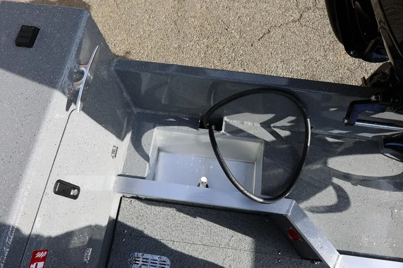 Slide: The Image of 2026 Thunder Jet 229 Rush OT boat interior with hose and storage compartment. - 30