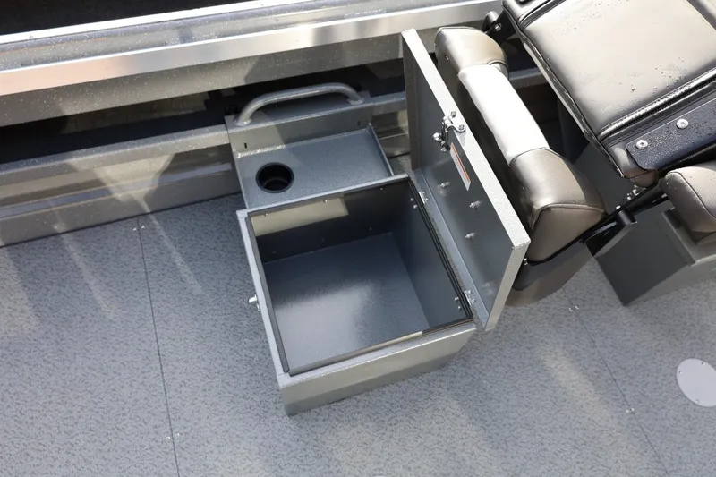 Slide: The Image of Open storage compartment in 2026 Thunder Jet 229 Rush OT boat interior. - 34