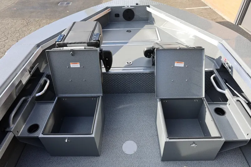 Slide: The Image of 2026 Thunder Jet 229 Rush OT boat interior with open storage compartments and seating. - 35
