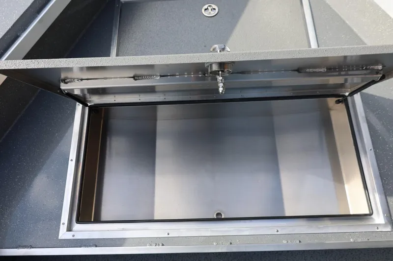 Slide: The Image of Open storage compartment of 2026 Thunder Jet 229 Rush OT boat. - 36