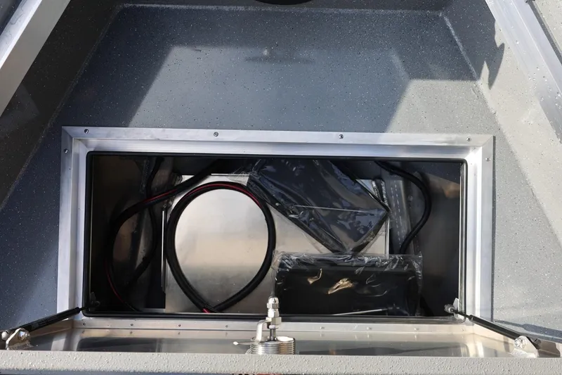 Slide: The Image of Open storage compartment in 2026 Thunder Jet 229 Rush OT boat. - 37
