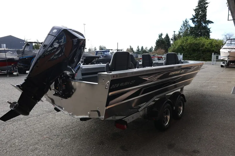 Slide: The Image of 2026 Thunder Jet 229 Rush OT boat with outboard motor on trailer. - 7