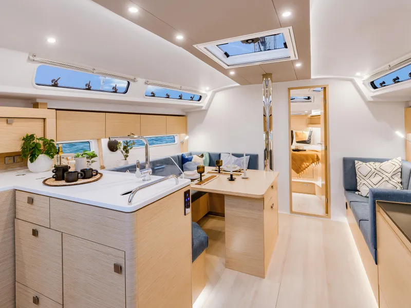 Slide: The Image of Luxurious interior of 2025 Hanse 410 yacht with modern kitchen and seating area. - 21