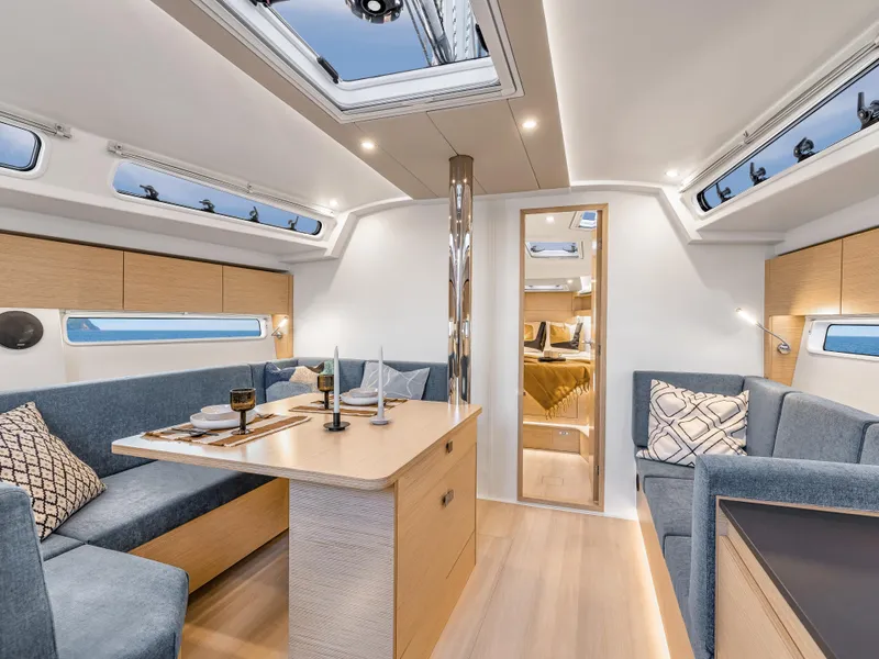 Slide: The Image of Luxurious interior of 2025 Hanse 410 yacht with modern dining area and skylights. - 22