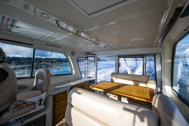 Slide: The Image of Interior of 2008 Back Cove 33 boat with scenic water view through large windows. - 19