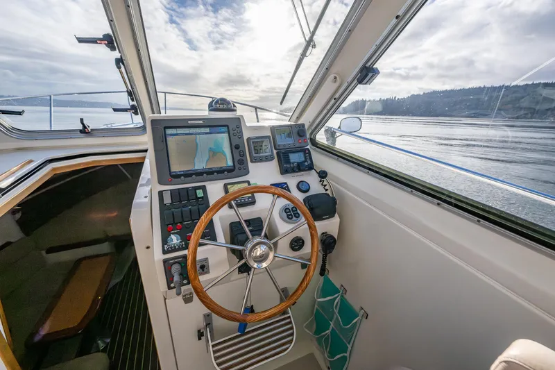 Slide: The Image of 2008 Back Cove 33 boat helm with navigation equipment and scenic water view. - 26