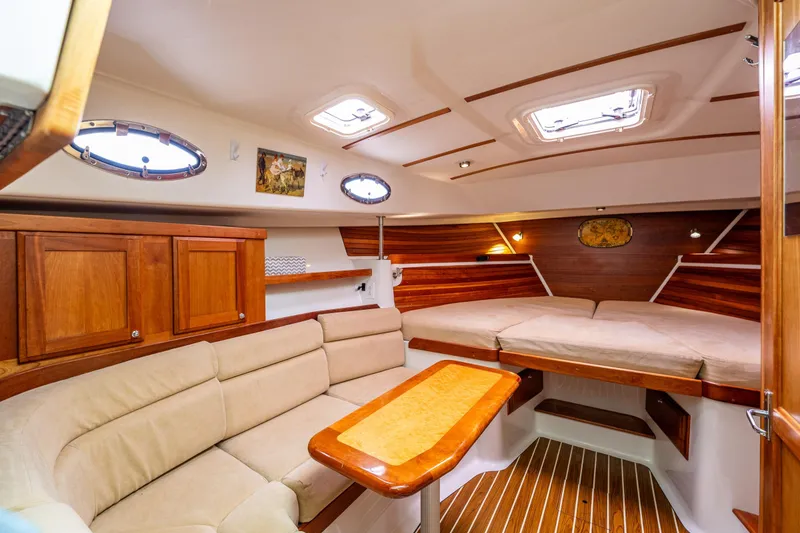 Slide: The Image of Luxurious interior of 2008 Back Cove 33 yacht with cozy seating and elegant wood finishes. - 3