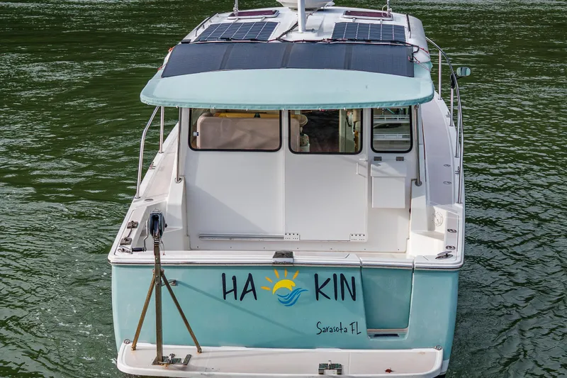 Slide: The Image of 2008 Back Cove 33 boat with solar panels, docked in Sarasota, FL. - 9