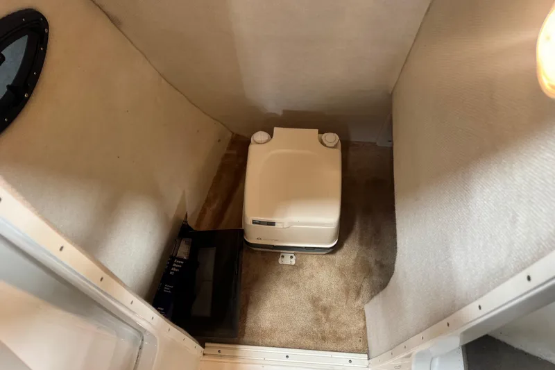 Slide: The Image of Compact bathroom with portable toilet in 2003 Regal 2900 LSR boat. - 13