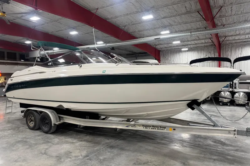 Slide: The Image of 2003 Regal 2900 LSR boat on trailer in indoor storage facility. - 2