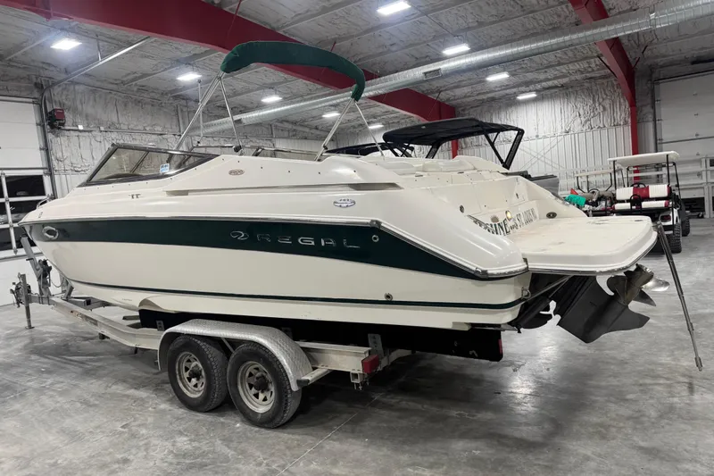 Slide: The Image of 2003 Regal 2900 LSR boat on trailer in indoor storage facility. - 3