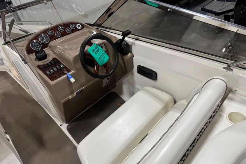 Slide: The Image of 2003 Regal 2900 LSR boat interior with steering wheel and dashboard controls. - 7