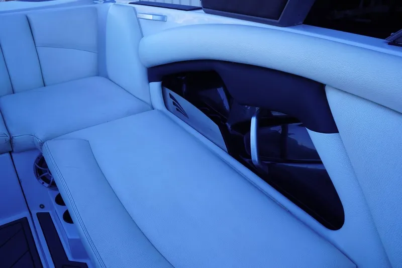 Slide: The Image of Interior seating of 2018 Tigé R22 boat, featuring sleek design and comfortable upholstery. - 15