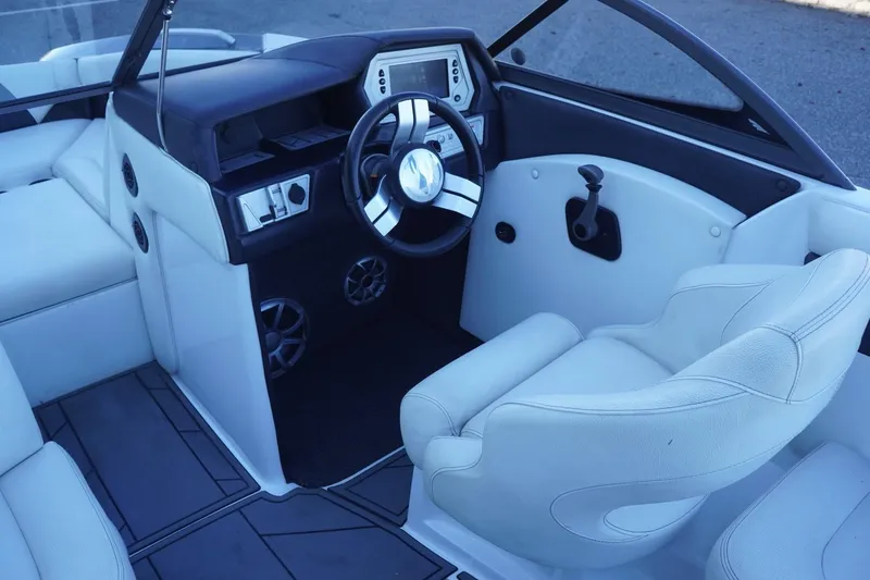 Slide: The Image of 2018 Tigé R22 boat interior with modern dashboard and comfortable seating. - 16