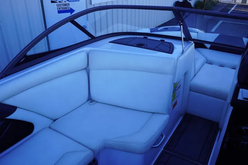 Slide: The Image of 2018 Tigé R22 boat interior with white seating and sleek design. - 17