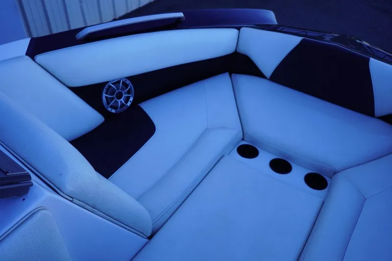 Slide: The Image of Interior seating of 2018 Tigé R22 boat with speaker and cup holders. - 19
