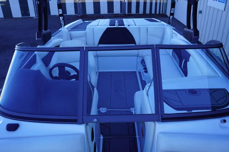 Slide: The Image of 2018 Tigé R22 boat interior with white seating and sleek design. - 20