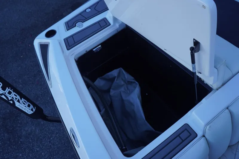 Slide: The Image of Open storage compartment in 2018 Tigé R22 boat, showcasing interior space. - 25