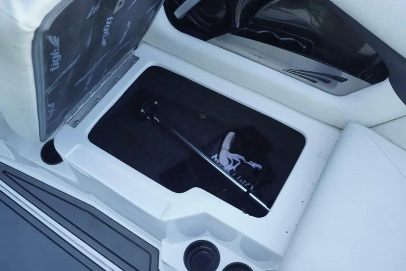 Slide: The Image of Storage compartment in 2018 Tigé R22 boat with accessories inside. - 28