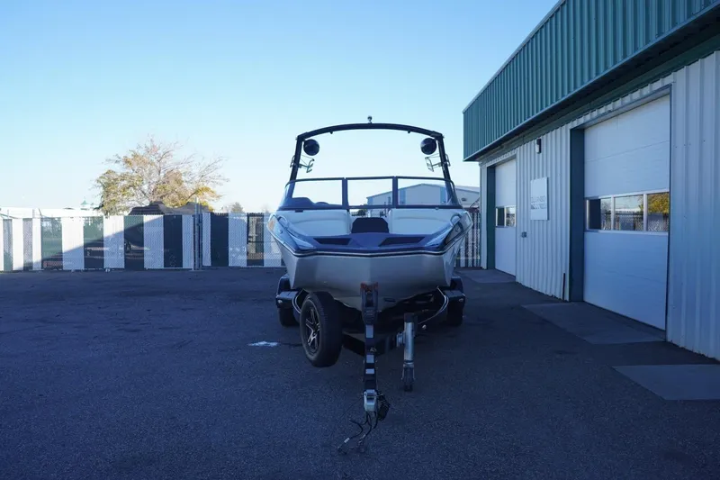 Slide: The Image of 2018 Tigé R22 boat on trailer outside a warehouse. - 4