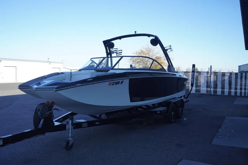 Slide: The Image of 2018 Tigé R22 boat on trailer in outdoor storage area. - 5