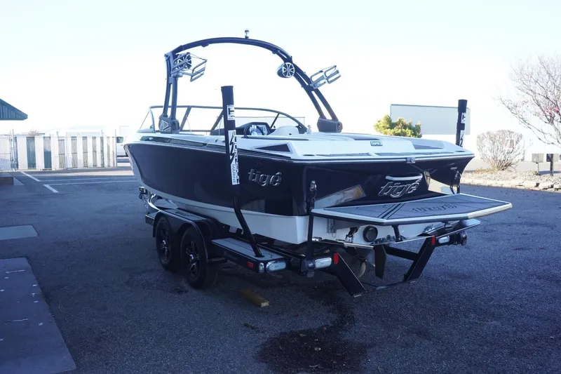 Slide: The Image of 2018 Tigé R22 boat on trailer, parked outdoors, rear view. - 7