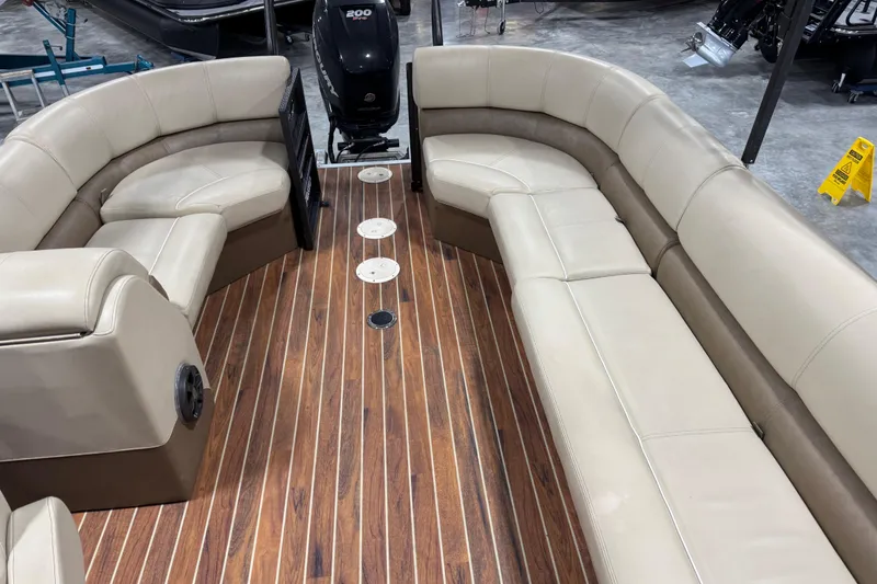 Slide: The Image of Luxurious seating on 2017 Crest III 250 boat with wood-style flooring. - 10