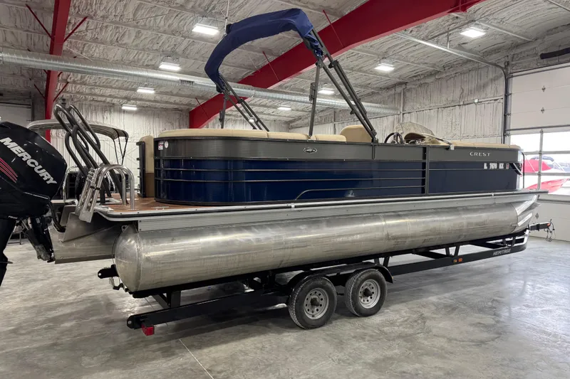Slide: The Image of 2017 Crest III 250 pontoon boat on trailer in indoor storage facility. - 3