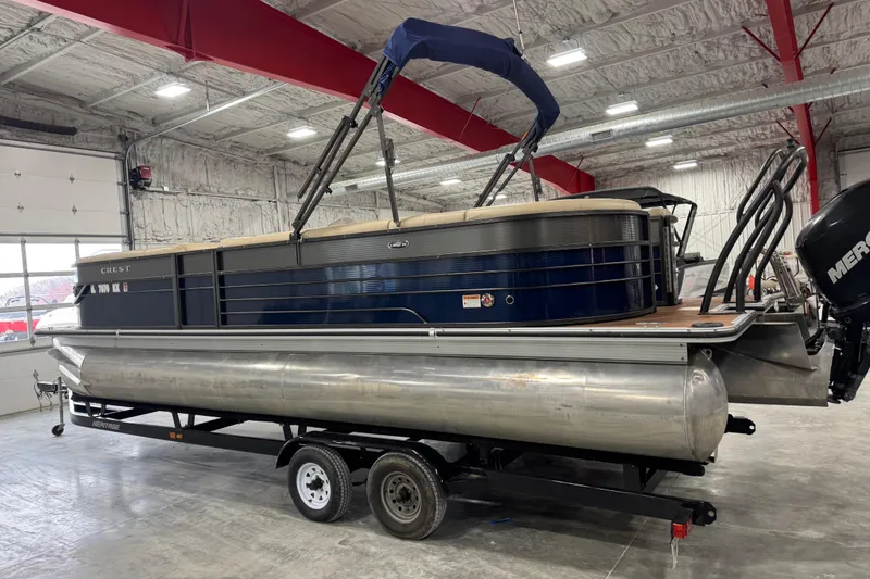 Slide: The Image of 2017 Crest III 250 pontoon boat on trailer in indoor storage facility. - 4
