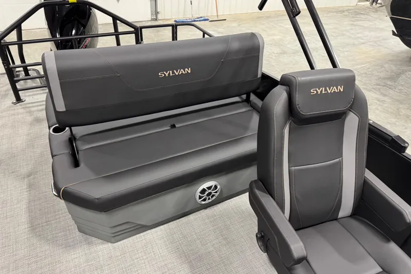 Slide: The Image of 2026 Sylvan Mirage X X5 boat interior with sleek black seating and logo. - 12