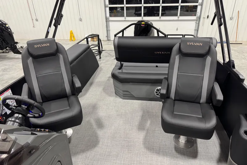 Slide: The Image of 2026 Sylvan Mirage X X5 boat interior with sleek black seating and modern design. - 13